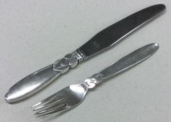 GEORG JENSEN: A heavy silver knife and fork of typ