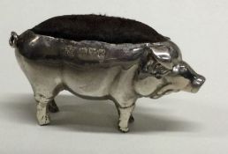 CHESTER: A silver pin cushion in the form of a pig. 1910. By Boots Pure Drug Company. Approx. 22