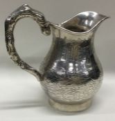 A good quality engraved Chinese silver cream jug o