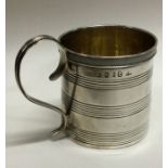 A George III silver christening mug with reeded decoration. London 1812. Retailed By Tessiers.