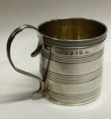 A George III silver christening mug with reeded decoration. London 1812. Retailed By Tessiers.