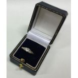 A small diamond single stone ring in 18 carat gold