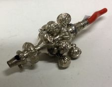 An early 19th Century silver rattle with coral handle. Approx.47 grams. Est. £150 - £200.