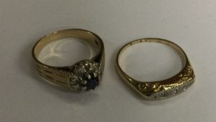 Two 9 carat diamond set rings. Approx. 5.4 grams.