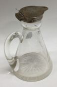 A silver mounted glass whisky noggin. Birmingham 1908. By Hukin and Heath. Est. £100 - £150.