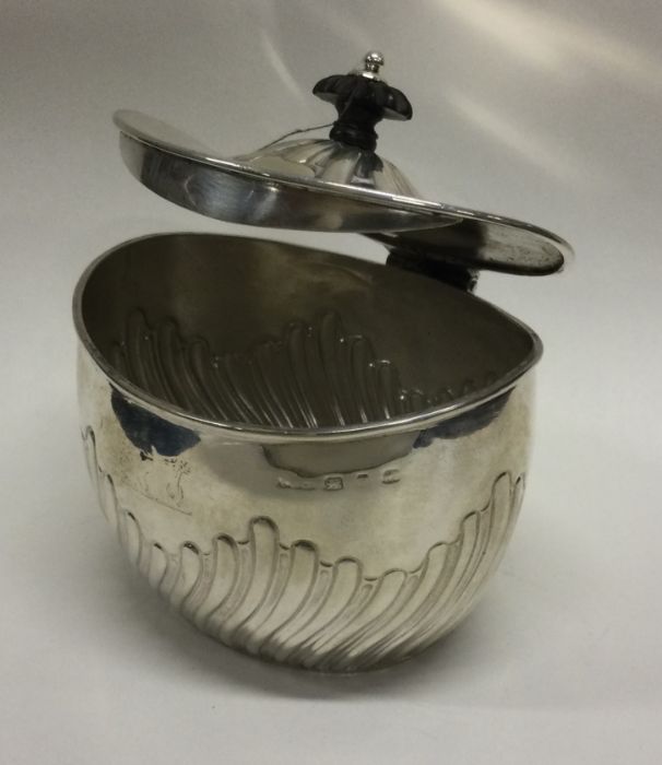 A silver fluted tea caddy with hinged lid. Birmingham. Approx. 115 grams. Est. £80 - £120. - Image 2 of 2