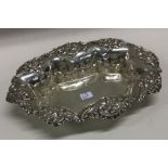 A good pierced silver bonbon dish with floral deco