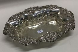 A good pierced silver bonbon dish with floral deco