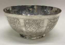 An early 19th Century Chinese silver bowl engraved with trees and temples. Approx. 233 grams.
