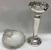 A silver butter shell together with a spill vase.
