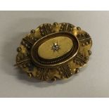 A 15 carat gold diamond target brooch. Approx. 5.4