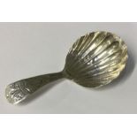 A George III 18th Century fluted silver caddy spoon. London 1794. Approx. 8 grams. Est. £30 - £50.