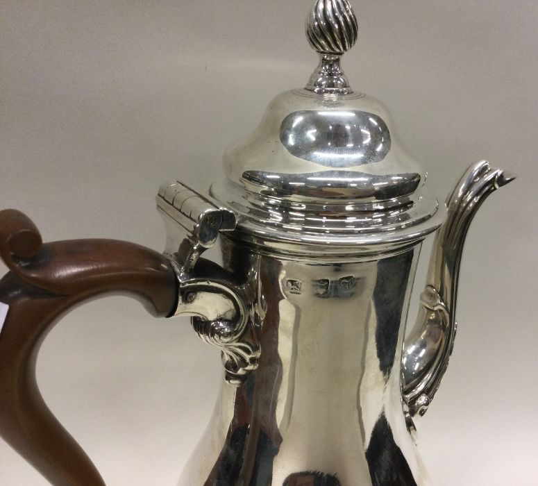 An 18th Century silver crested coffee pot. London 1764. Maker’s mark to base. Approx. 730 grams. - Image 2 of 2