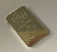 A silver 20 gram ingot. Approx.20 grams. Est. £20 - £30.