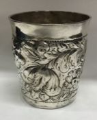 A large early 18th Century chased silver beaker. Maker’s mark only to base. Approx. 120 grams.
