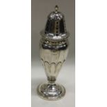 A heavy silver mounted caster with fluted decorati