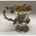 A fine embossed Victorian silver christening mug. London 1840. By Benoni Stephens. Approx. 117