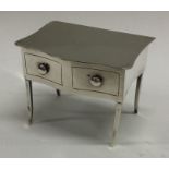 CHESTER: A rare silver hinged box in the form of a table. 1920. By Joseph and Richard Griffin.