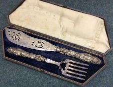 A pair of heavy Victorian silver handled fish servers. Sheffield. By Aaron Hadfield. Approx. 338