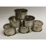 CHESTER: A set of six silver napkin rings with engine turned decoration. 1943. Approx. 70 grams.
