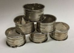 CHESTER: A set of six silver napkin rings with engine turned decoration. 1943. Approx. 70 grams.