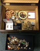 A box containing gold plated and other costume jew