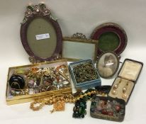 A quantity of beads, necklaces, picture frames etc
