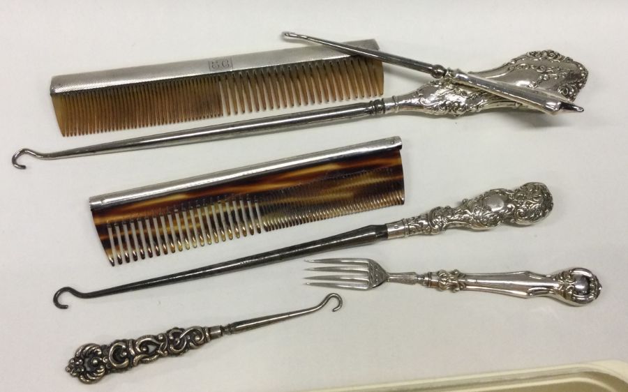 Two silver mounted combs etc. Est. £20 - £30.
