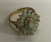 A good quality opal and diamond cluster ring in 18