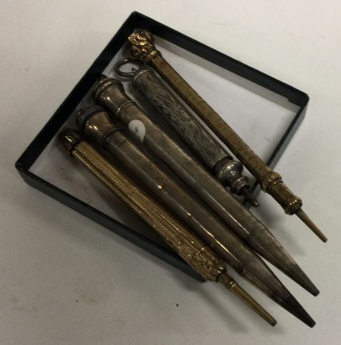 A collection of silver mounted extending pencils.