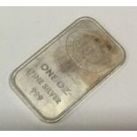 A one ounce silver ingot. Approx.31 grams. Est. £30 - £50.