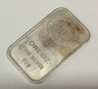 A one ounce silver ingot. Approx.31 grams. Est. £30 - £50.