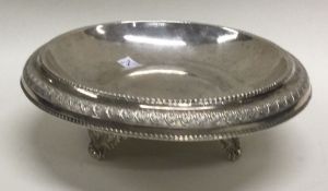 A Continental 18th/19th Century silver dish on figural feet. Maker’s mark only ‘GM’. Approx. 172