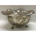 A Victorian silver chased fruit bowl on feet with bright cut engraved border. London 1850. By Robert