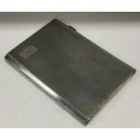 A heavy engine turned silver cigarette case. Appro