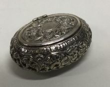 A Continental hinged silver box with chased decoration. Approx. 53 grams. Est. £40 - £60.