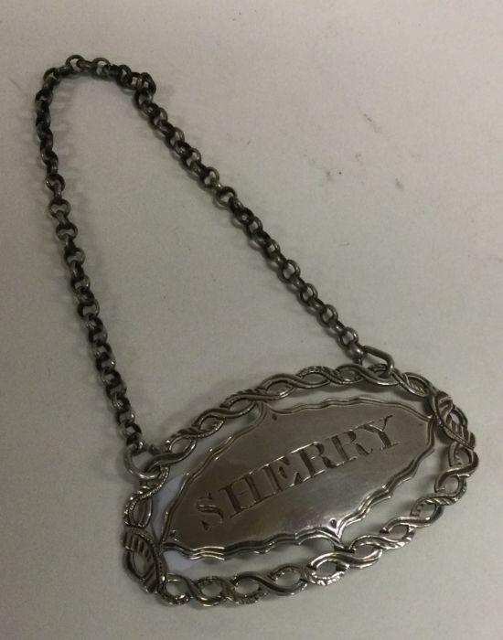 A large 18th Century silver wine label for ‘Sherry’ with pierced border. London circa 1790. By