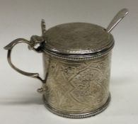 A Victorian silver mounted engraved glass mustard pot. London 1875. By Joseph Walton. Approx. 84