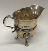 A good Georgian style silver cream jug with lion m