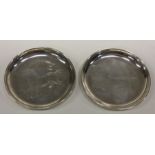 A pair of silver dishes engraved with horses. Signed to base. Approx. 68 grams. Est. £60 - £80.