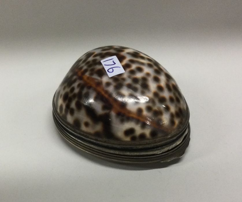 An 18th Century Provincial silver mounted cowrie shell snuff box. London circa 1750. By Ebenezer