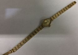 A lady's 9 carat wristwatch. Approx. 10.6 grams. E