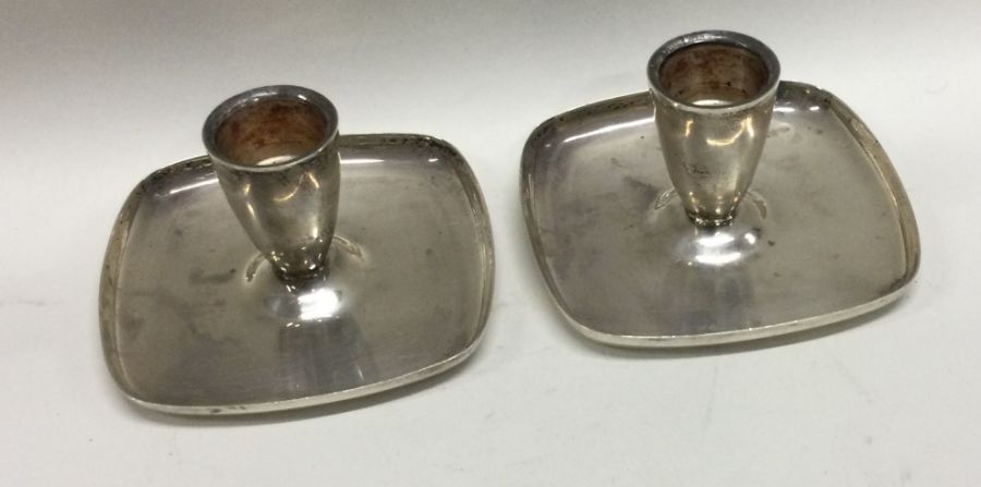 A pair of unusual silver chambersticks. Birmingham 1973. By AE Jones. Special mark used to
