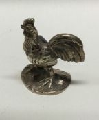A silver figure of a cockerel bearing import marks. Approx. 29 grams. Est. £60 - £80.