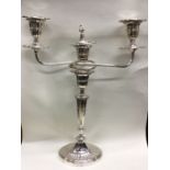 A heavy silver three branch candelabra of tapering