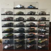 Thirty cased model racing cars. Est. £20-£30
