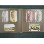 BOOKS: A POST CARD ALBUM with 24 racing cars, 31 trains, 21 aircraft, 30 ships. Est. £30 - £40.