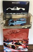 Four 1:18 scale boxed model racing cars. Est. £40-