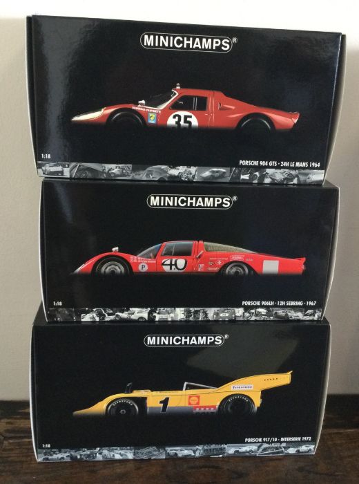 MINICHAMPS: Three various boxed model racing cars,