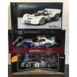 Three various boxed model racing cars, scale 1:18.